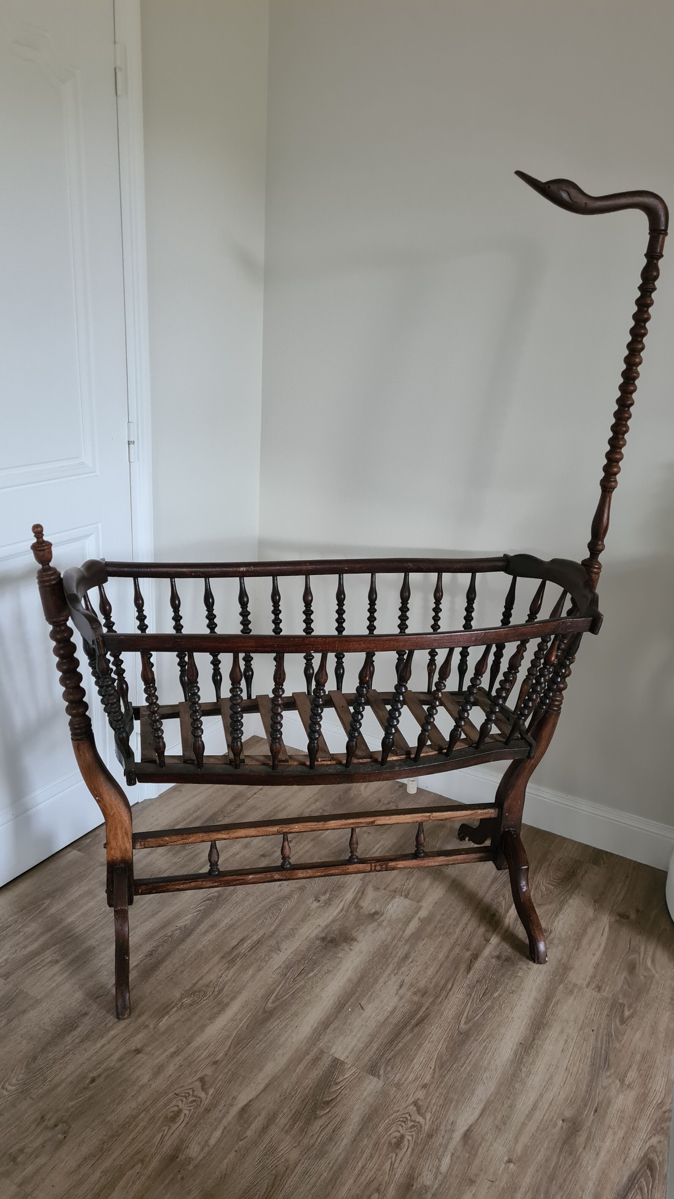 Old wooden rocking cradle twisted / vintage bars