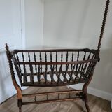 Old wooden rocking cradle twisted / vintage bars