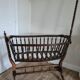 Old wooden rocking cradle twisted / vintage bars