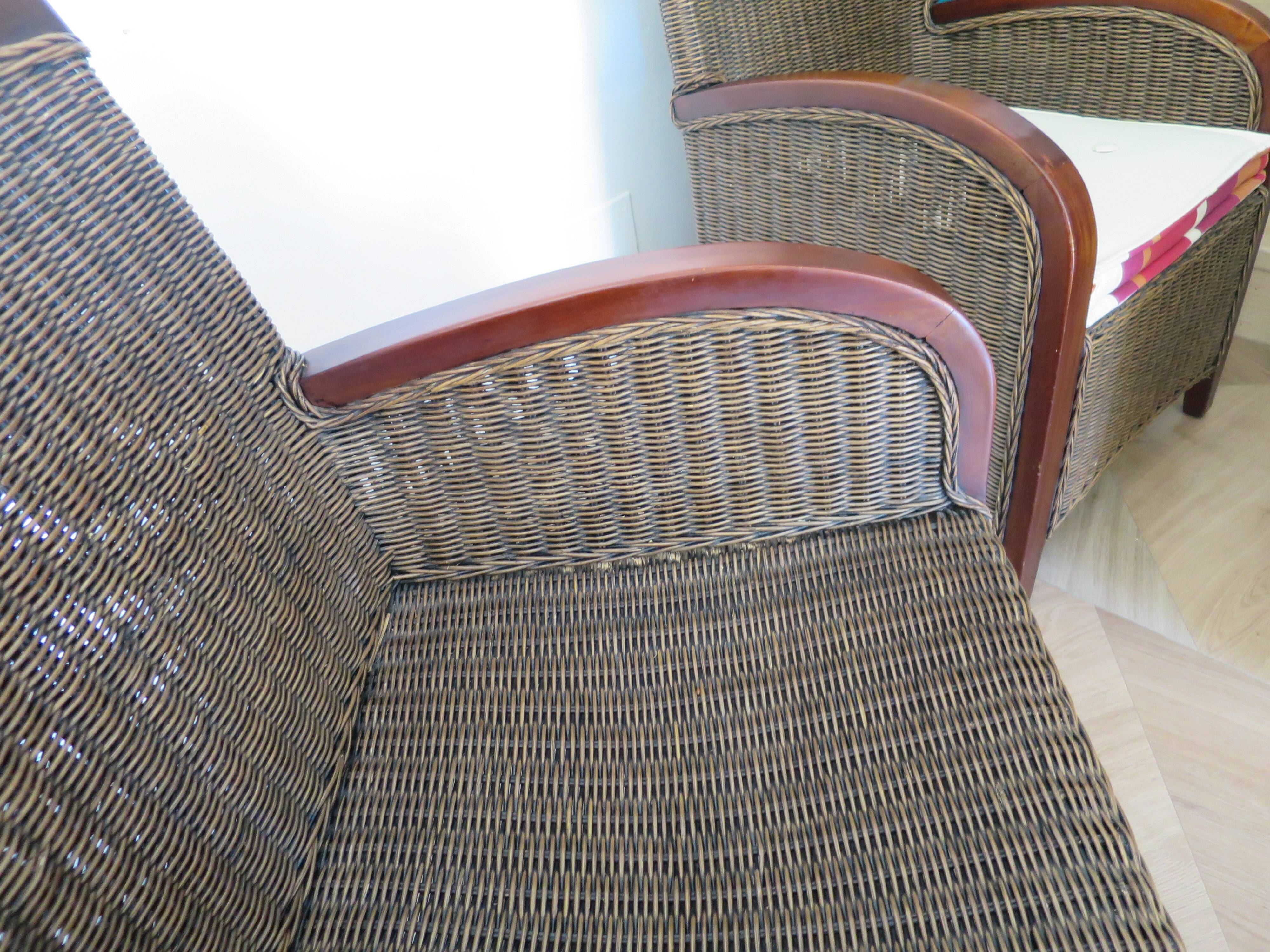 2 armchairs in woven rattan and wood, 1980s