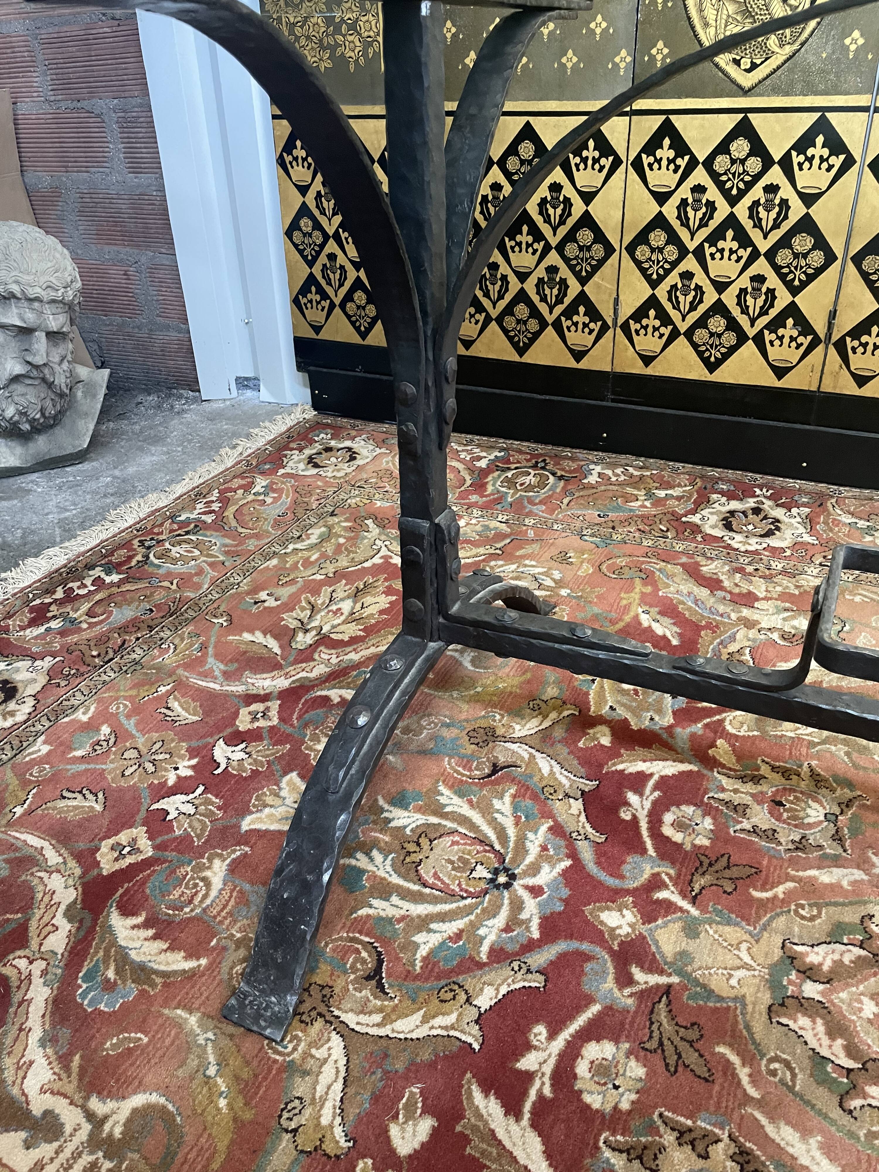 Dining table in wrought iron and glass