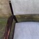 Wooden armchair and faux leather.