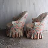 pair of toad armchairs in floral fabric.