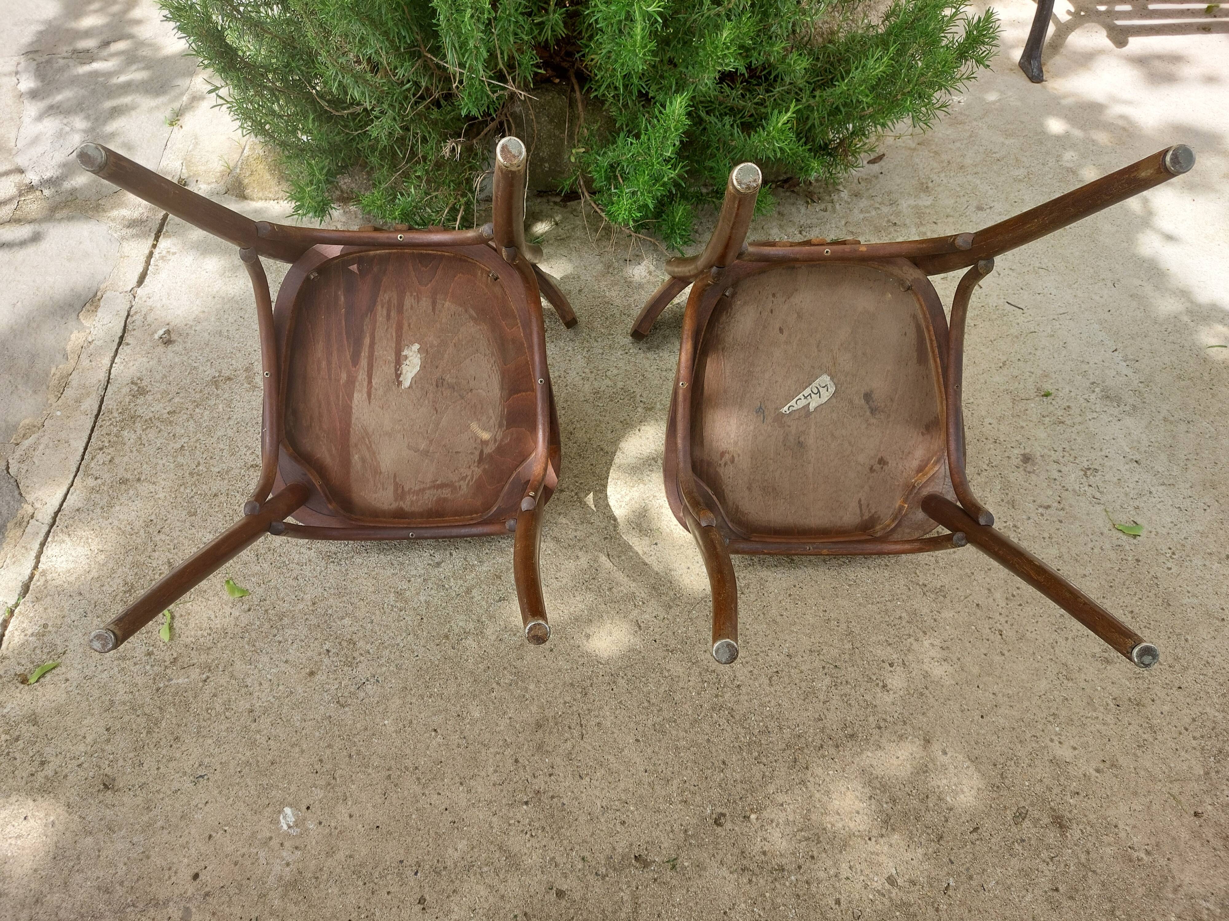 pair of dark bistro chairs, rounded backs, Baumann style