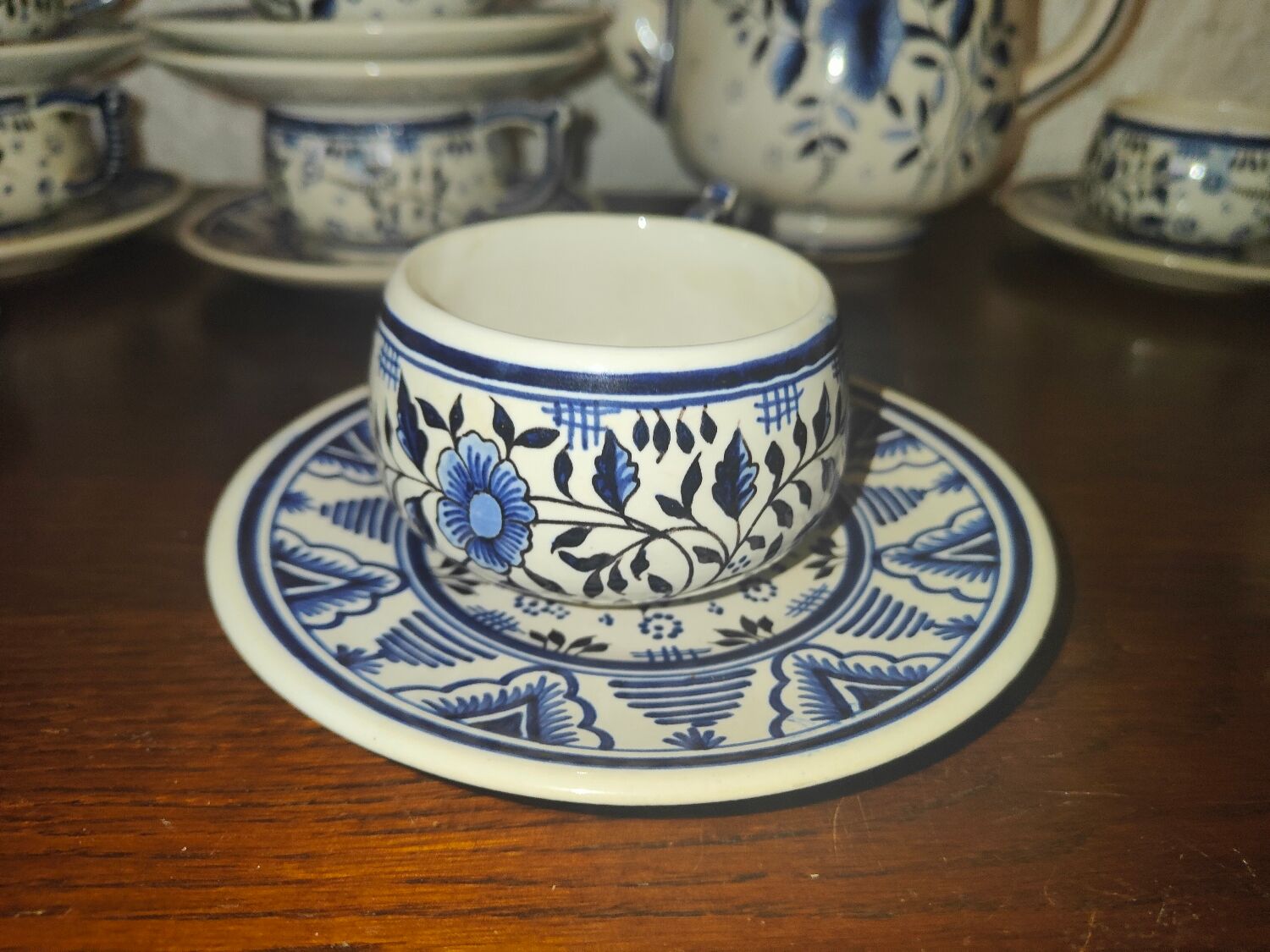Henriot Quimper earthenware coffee set with floral decoration and elegant blue