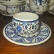 Henriot Quimper earthenware coffee set with floral decoration and elegant blue