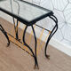 Vintage magazine holder "scoubidou" in black wrought iron.