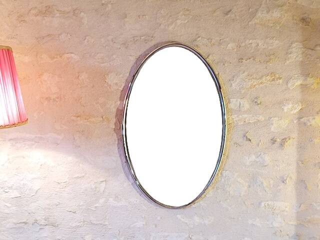 Oval art deco mirror with vintage chrome frame from the 70s