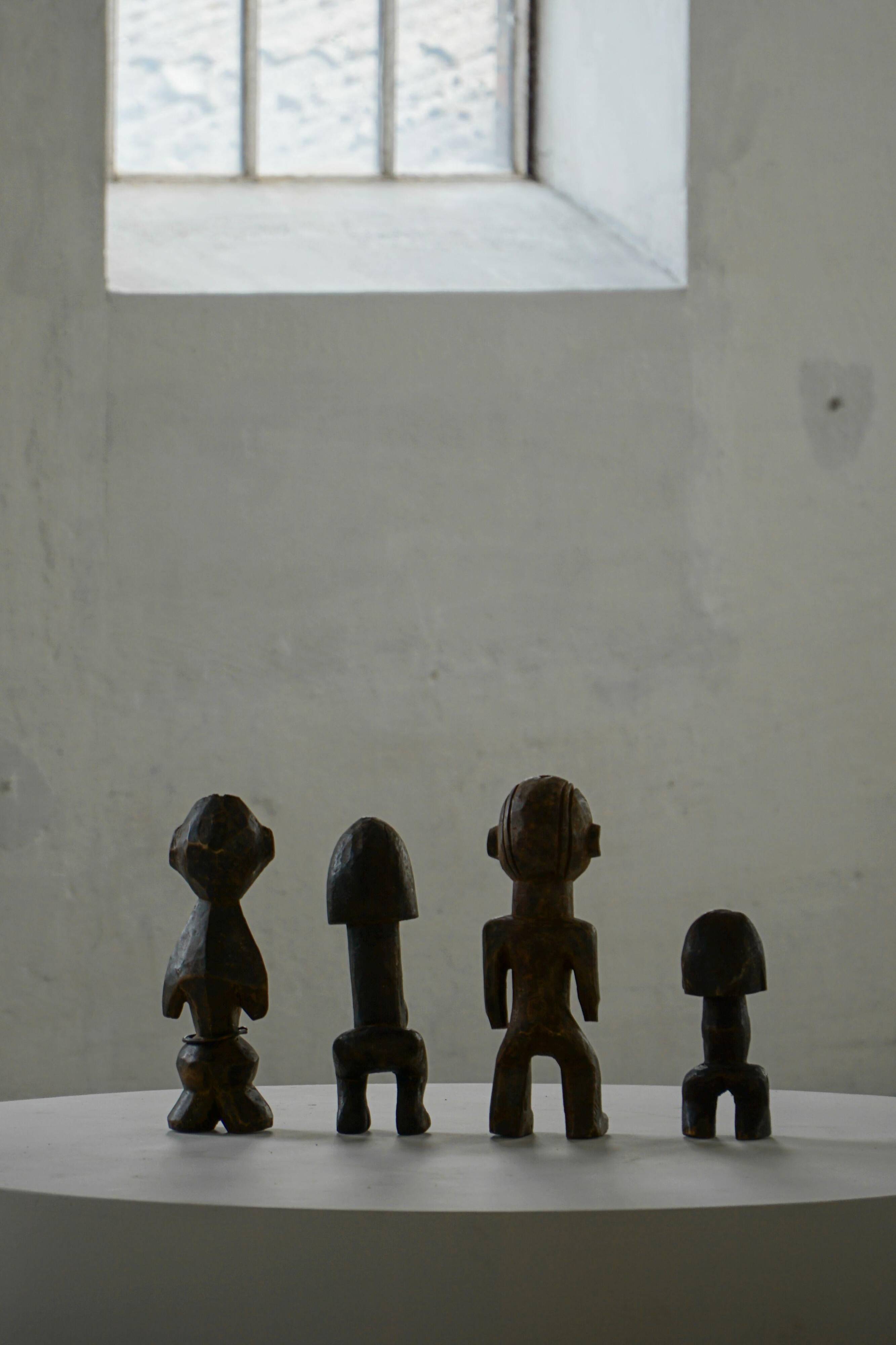 Set of 4 decorative handcrafted African wooden sculptures, mid-century.