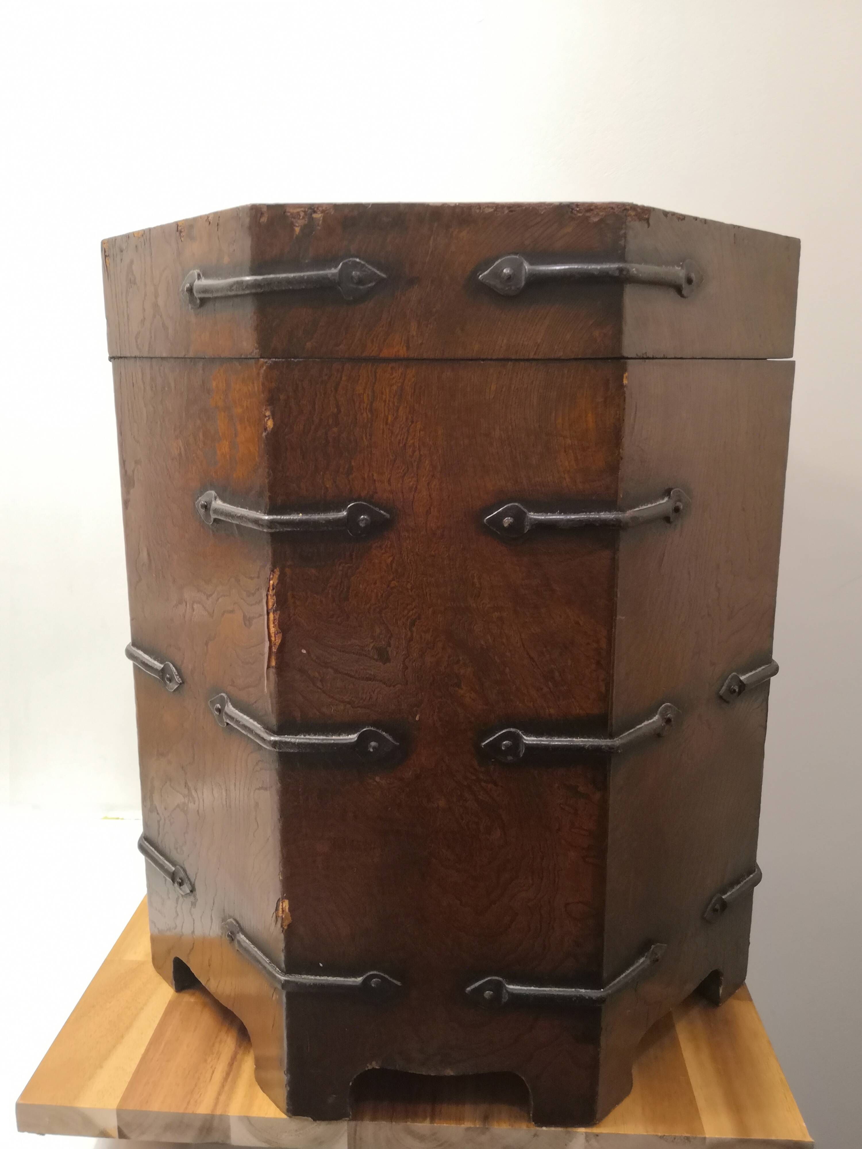 Octagonal wooden chest with metal ornaments from Asia