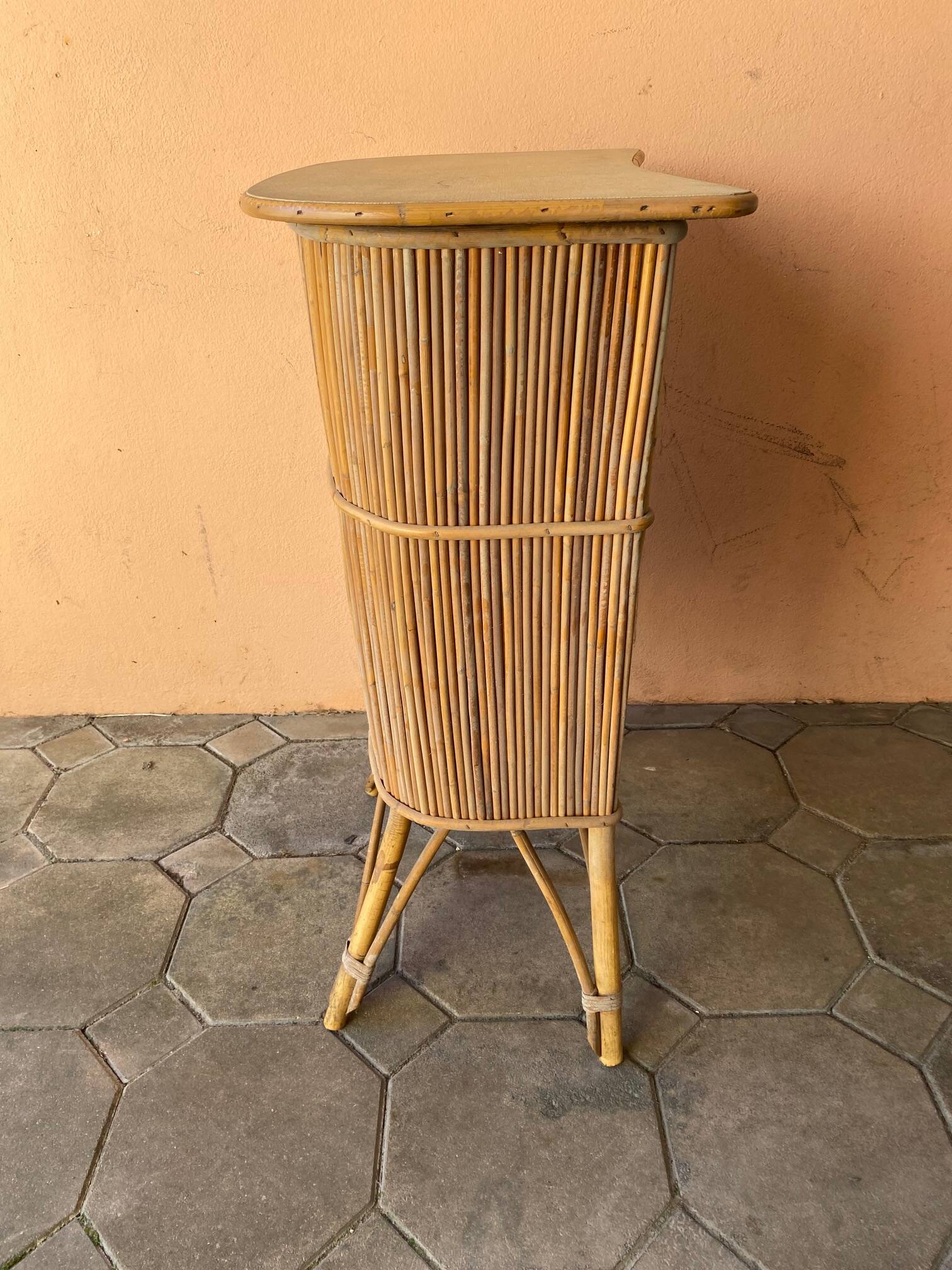 Vintage rattan bar from the 60s with rounded shapes and a shelf for glasses