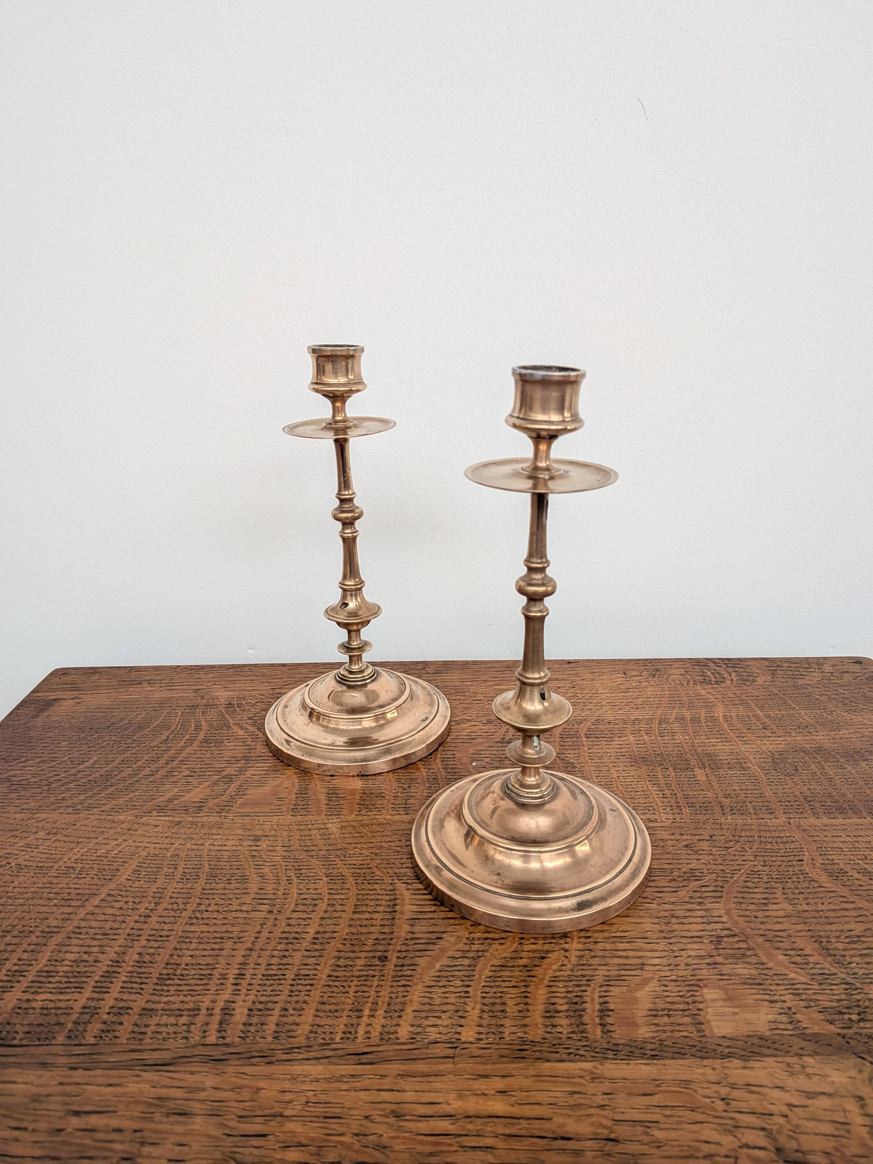 Pair of antique turned rose brass candlesticks (24 cm)