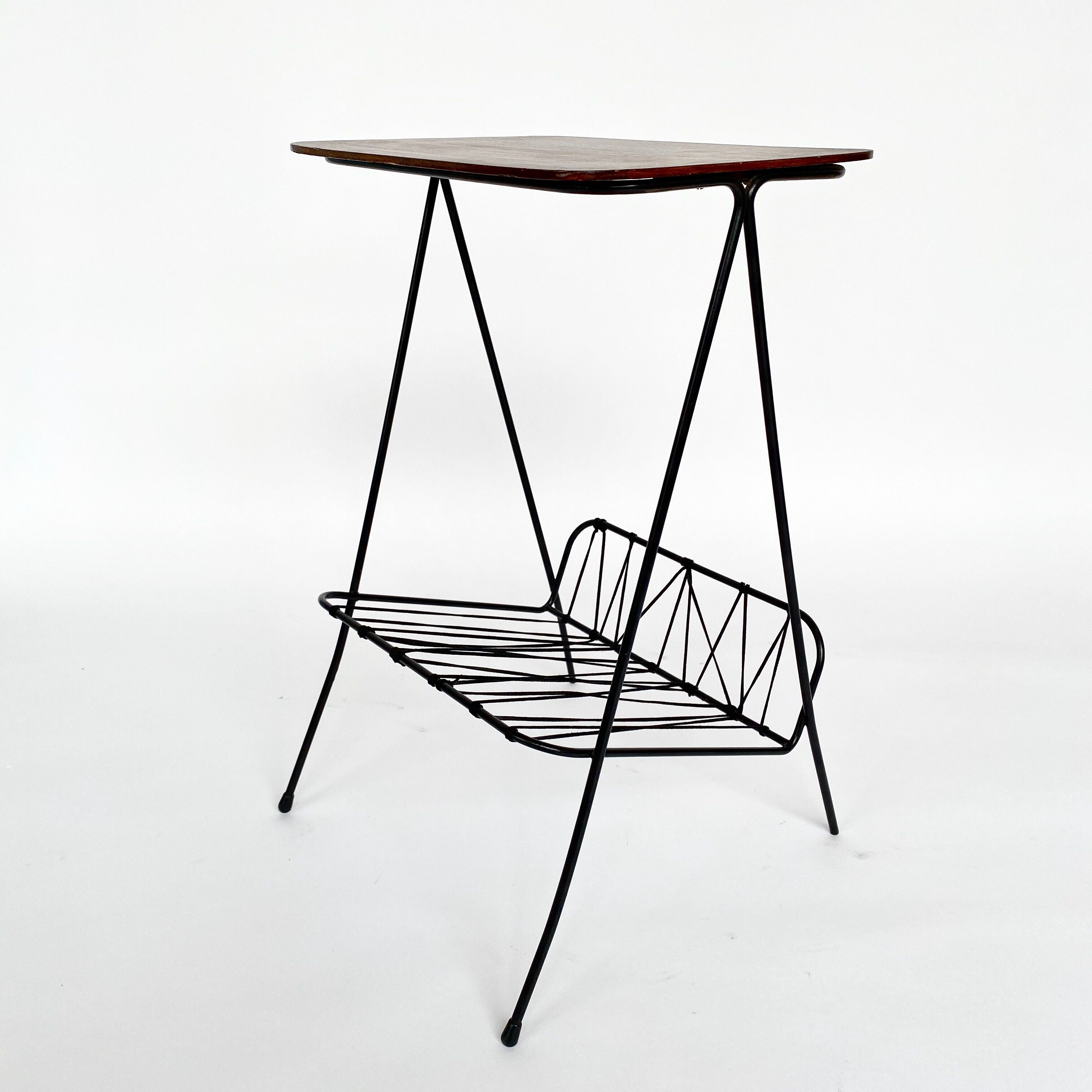 Side table with vintage metal and wood magazine holder