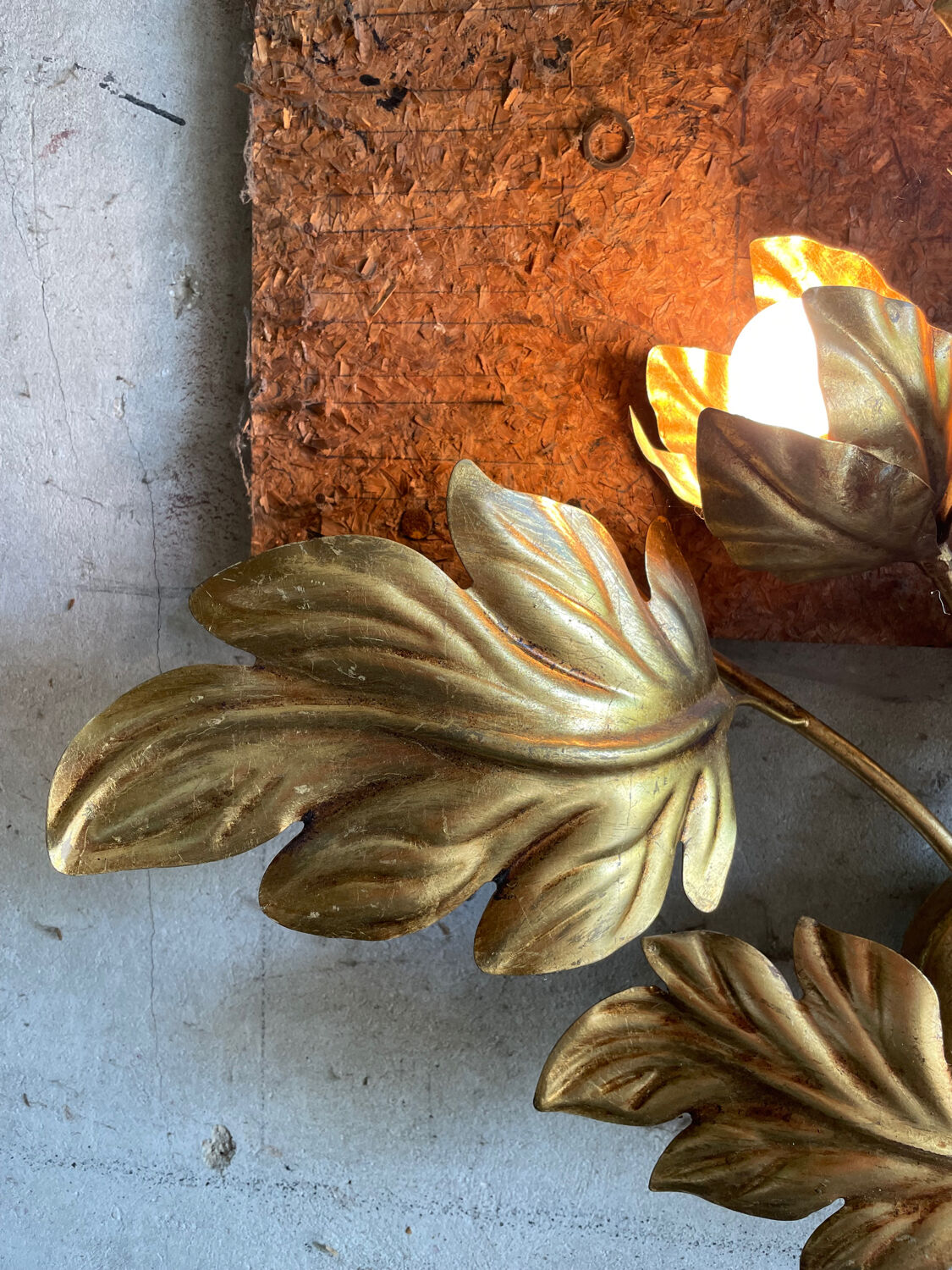 Golden wall lamp foliage