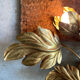Golden wall lamp foliage