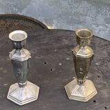 Pair of metal candlesticks, chiseled with a statuette in front, rose pattern in relief, art deco