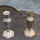 Pair of metal candlesticks, chiseled with a statuette in front, rose pattern in relief, art deco