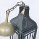 Old chandelier hanging lantern with candle in sheet metal