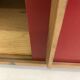 Vintage furniture with red sliding doors