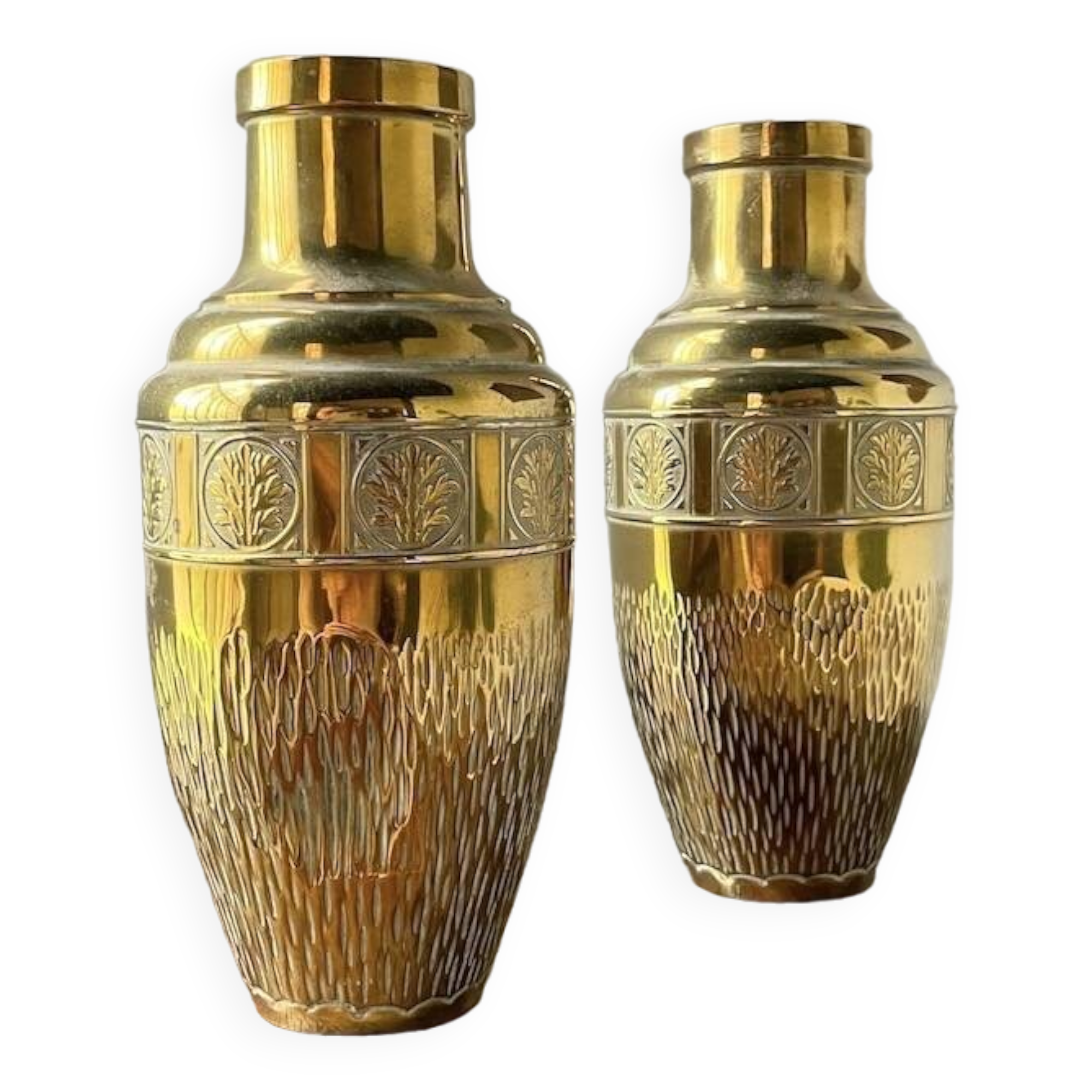 Duo of embossed brass vases