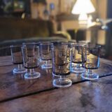 12 smoked glass stemmed glasses from the 70s and 80s.