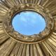Large sun mirror in carved gilded wood.