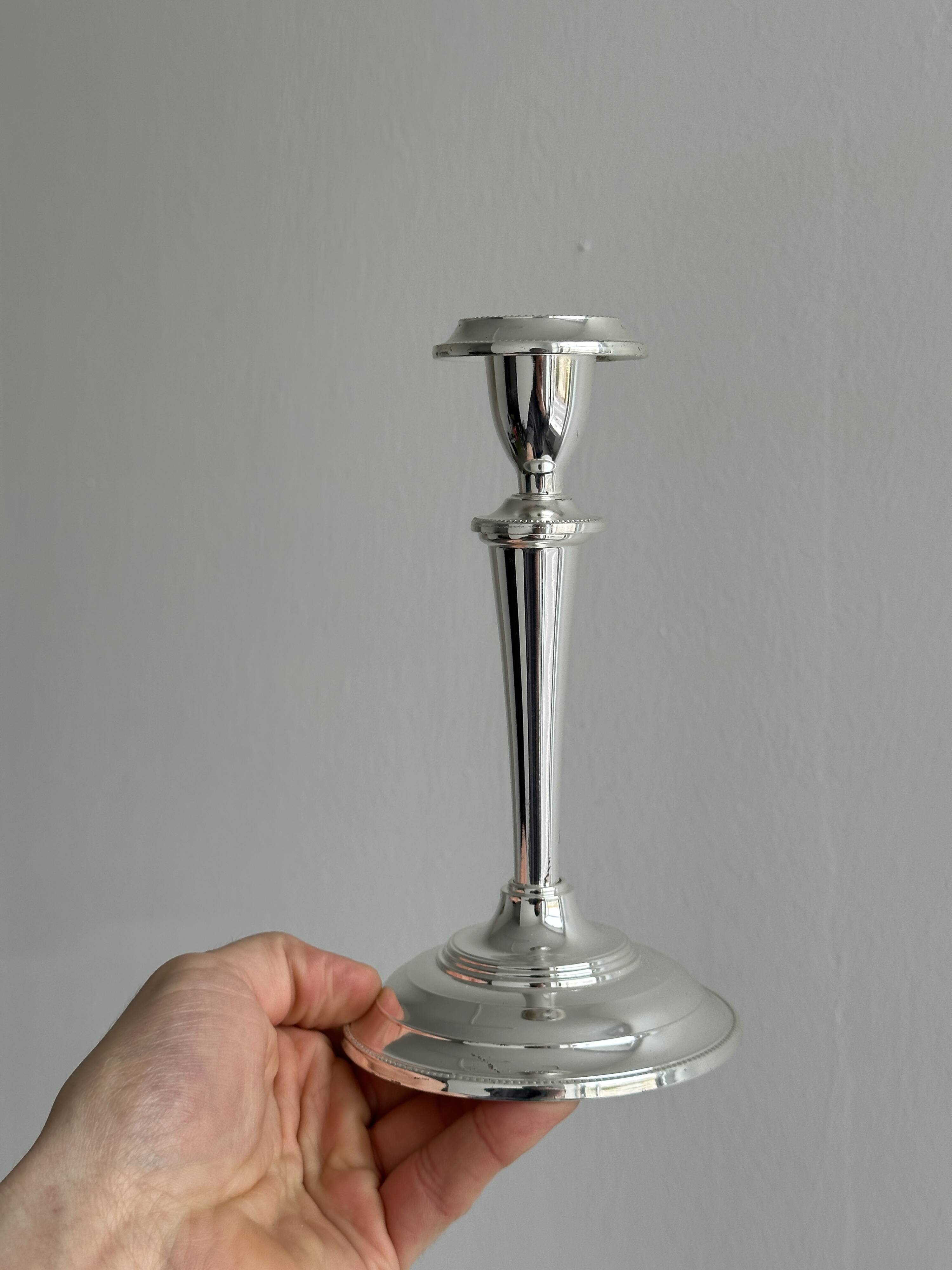Pair of elegant stainless steel candlesticks
