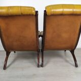 Pair of padded Chesterfield armchairs