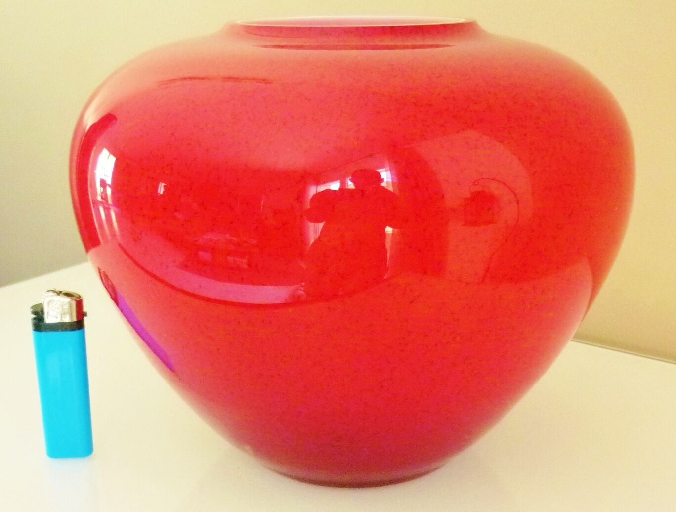 Pot-bellied, art deco vase in speckled ruby red multi-layered glass, white interior