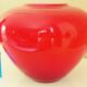 Pot-bellied, art deco vase in speckled ruby red multi-layered glass, white interior