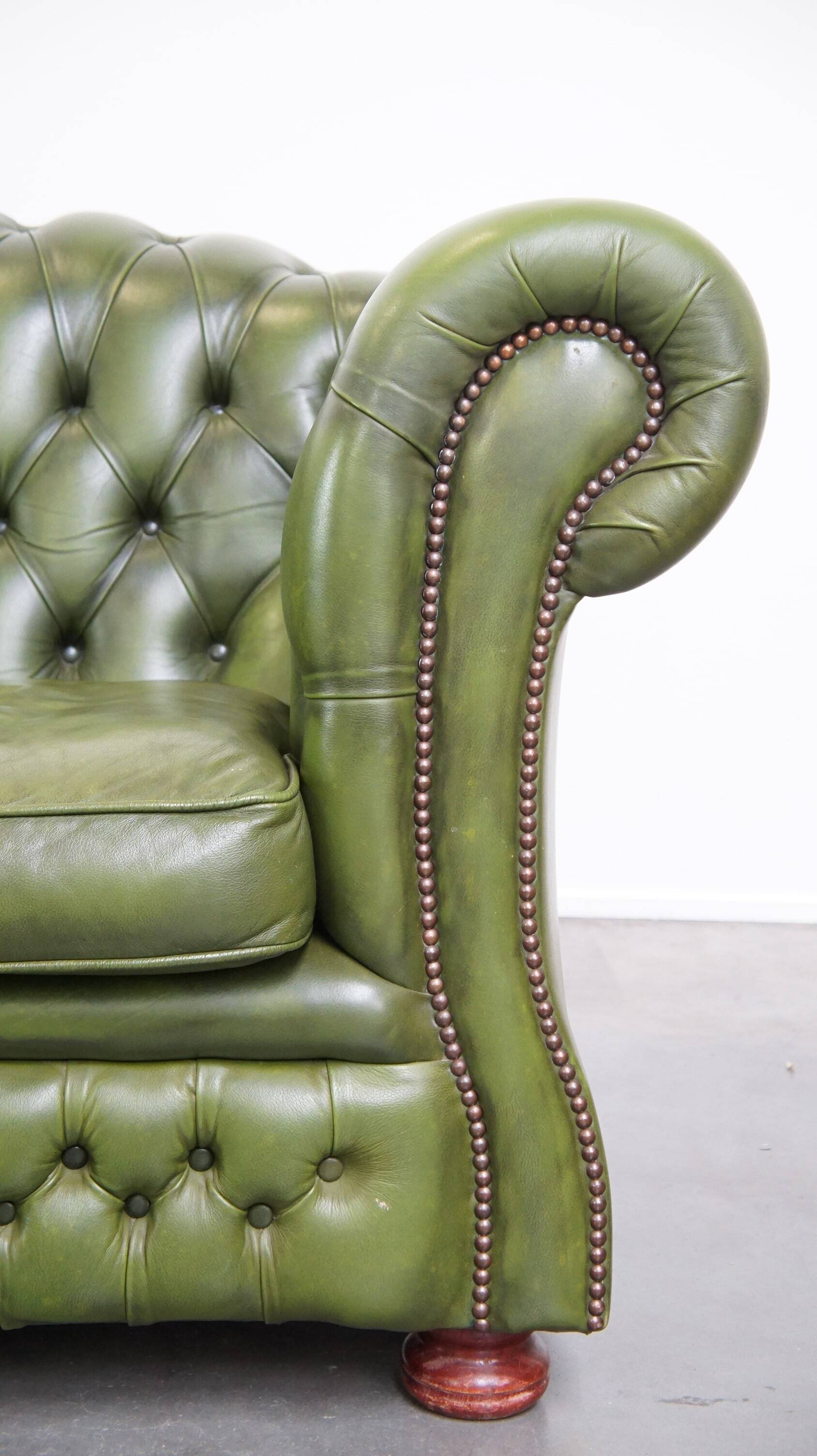 Stylish, English green cow leather spacious 2.5 seater chesterfield sofa