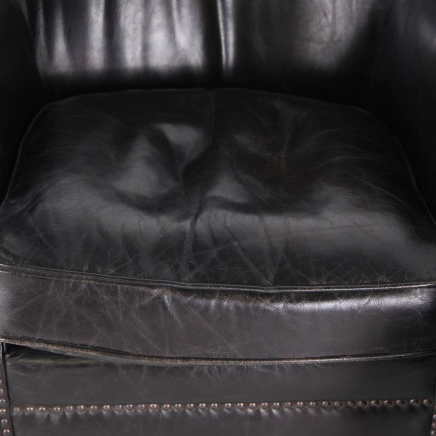 Pair of small leather club armchairs