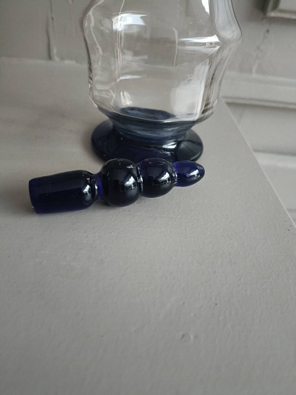 White and blue blown glass carafe