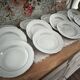 12 deep plates in porcelain with double gold trim.