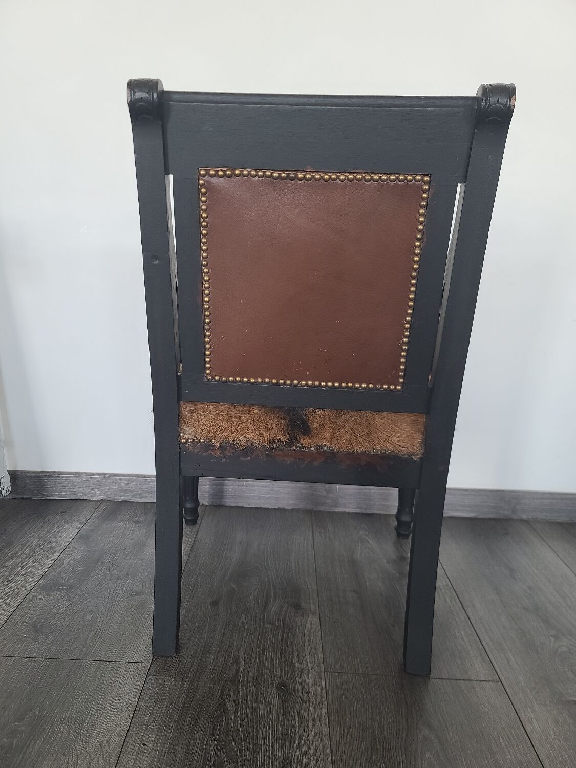 Character armchair in black wood and animal skin #CHMR