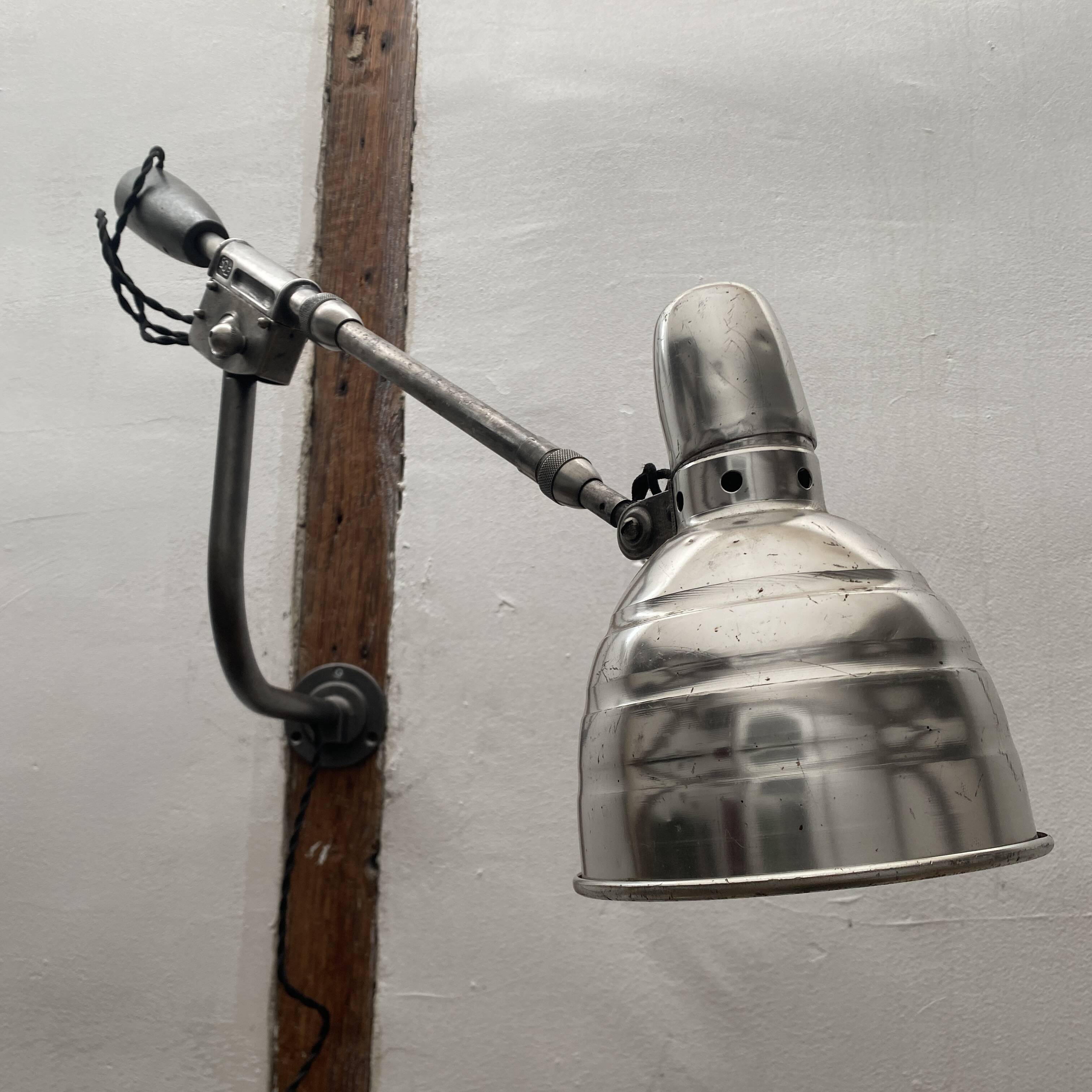 Old industrial wall light with counterweight.