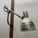 Old industrial wall light with counterweight.