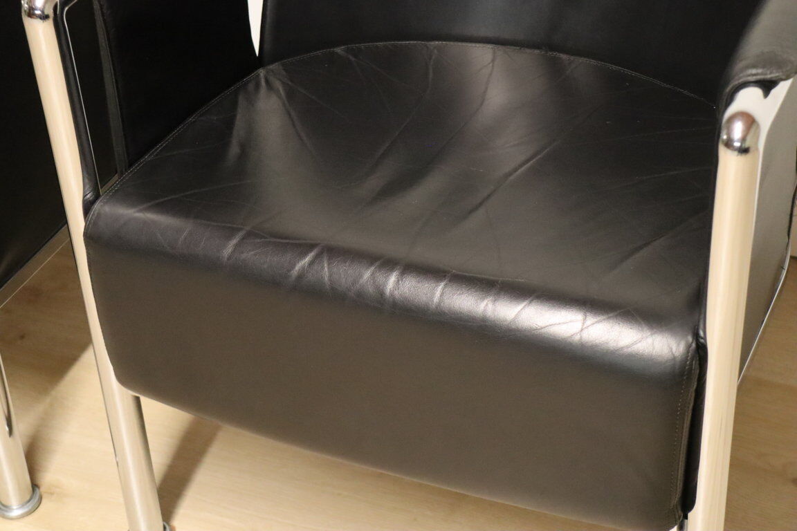 Pair of armchairs in synthetic leather and chromed metal, 1970