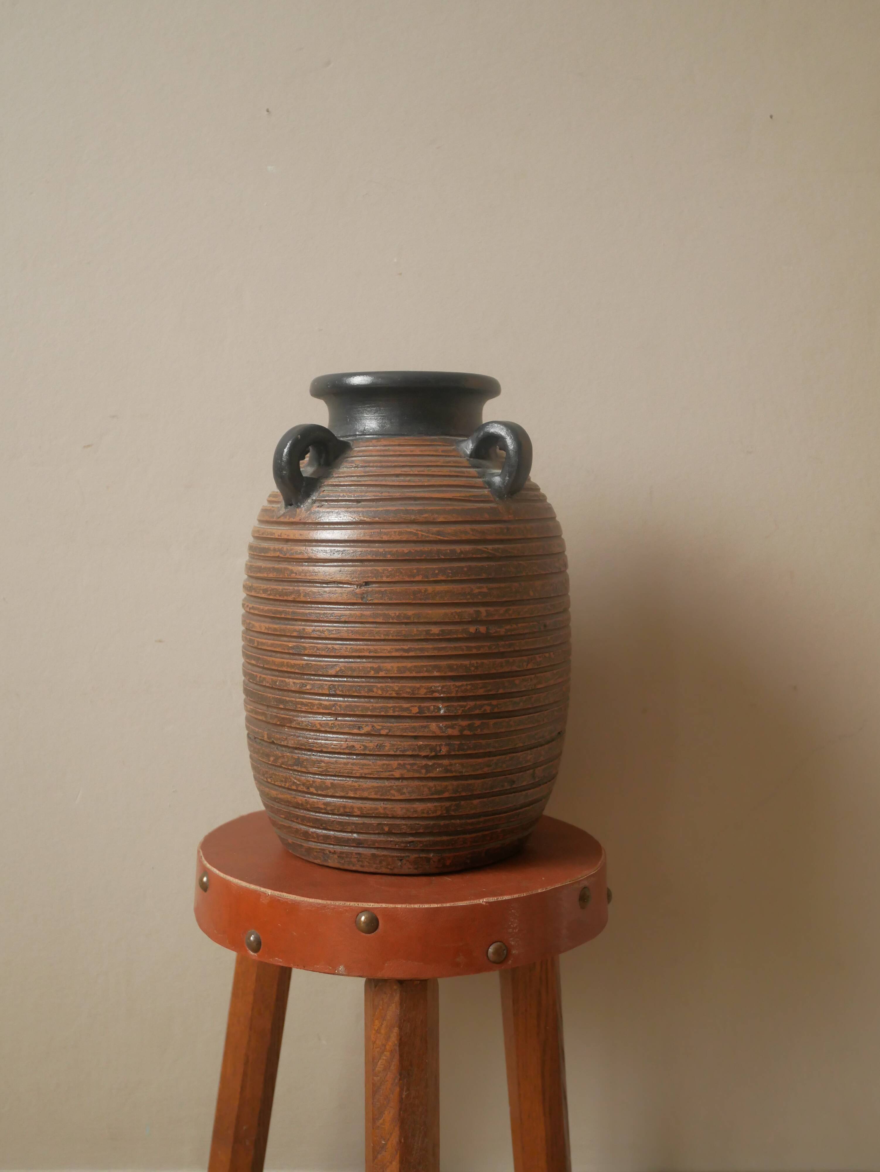 Vase with handles in vintage ceramic handmade pottery tribal ethnic decoration