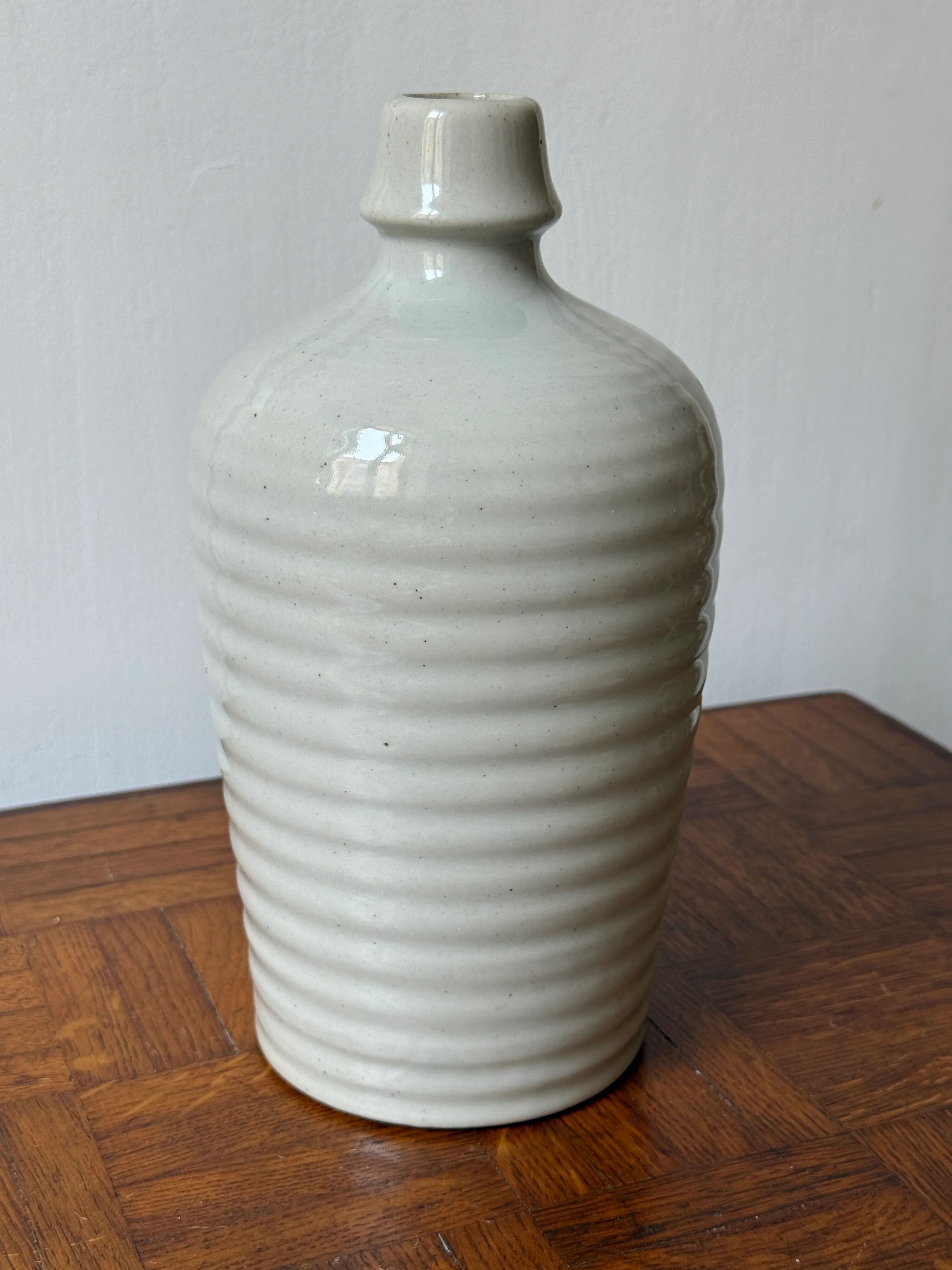 Old Japanese sake bottle in tokkuri shape.