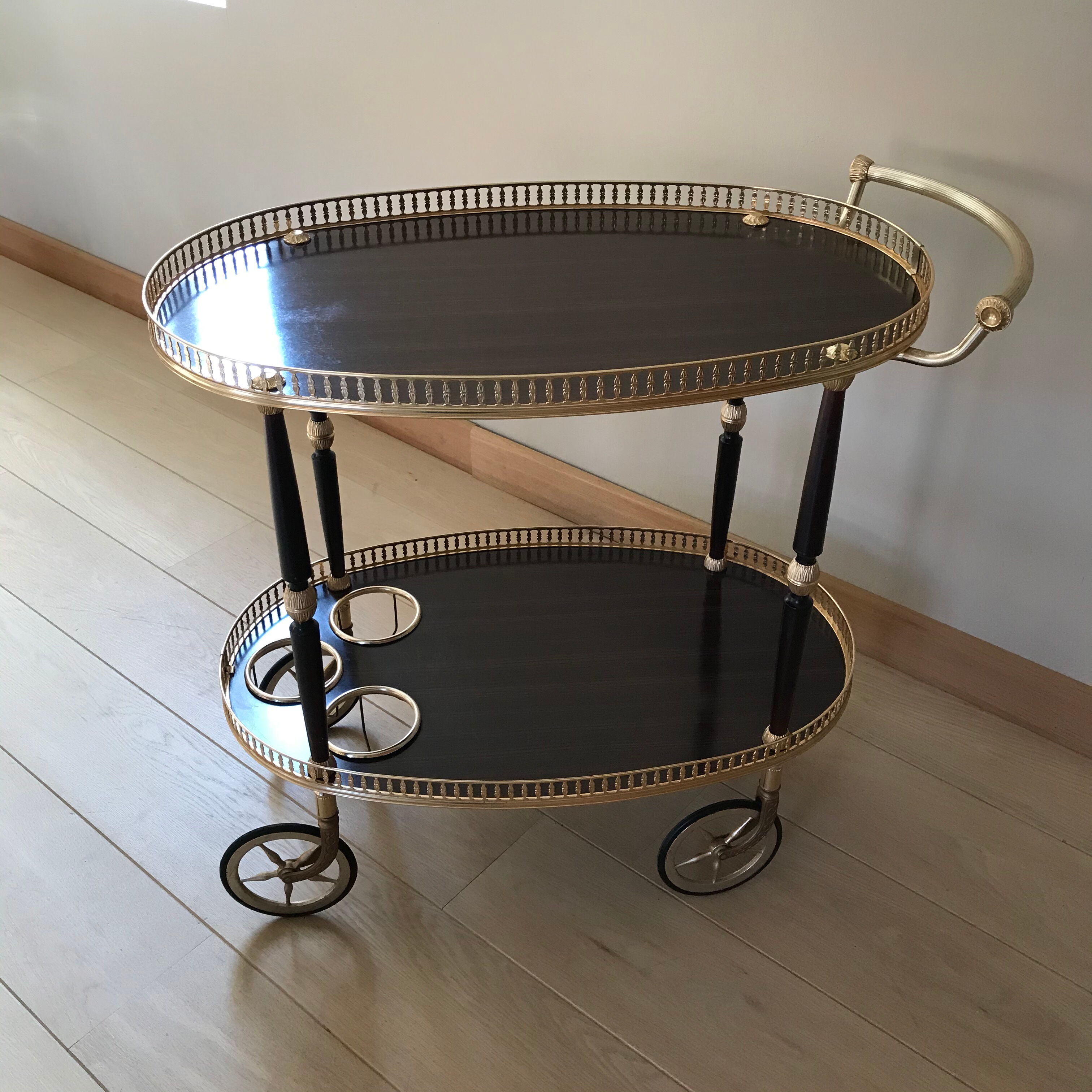 Golden wheeled serving trolley