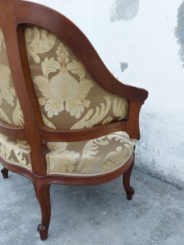 Fauteuil bergère louis XV en Noyer sculpté