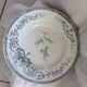 9 plates white background, light green pattern, 1930s Iron Earth