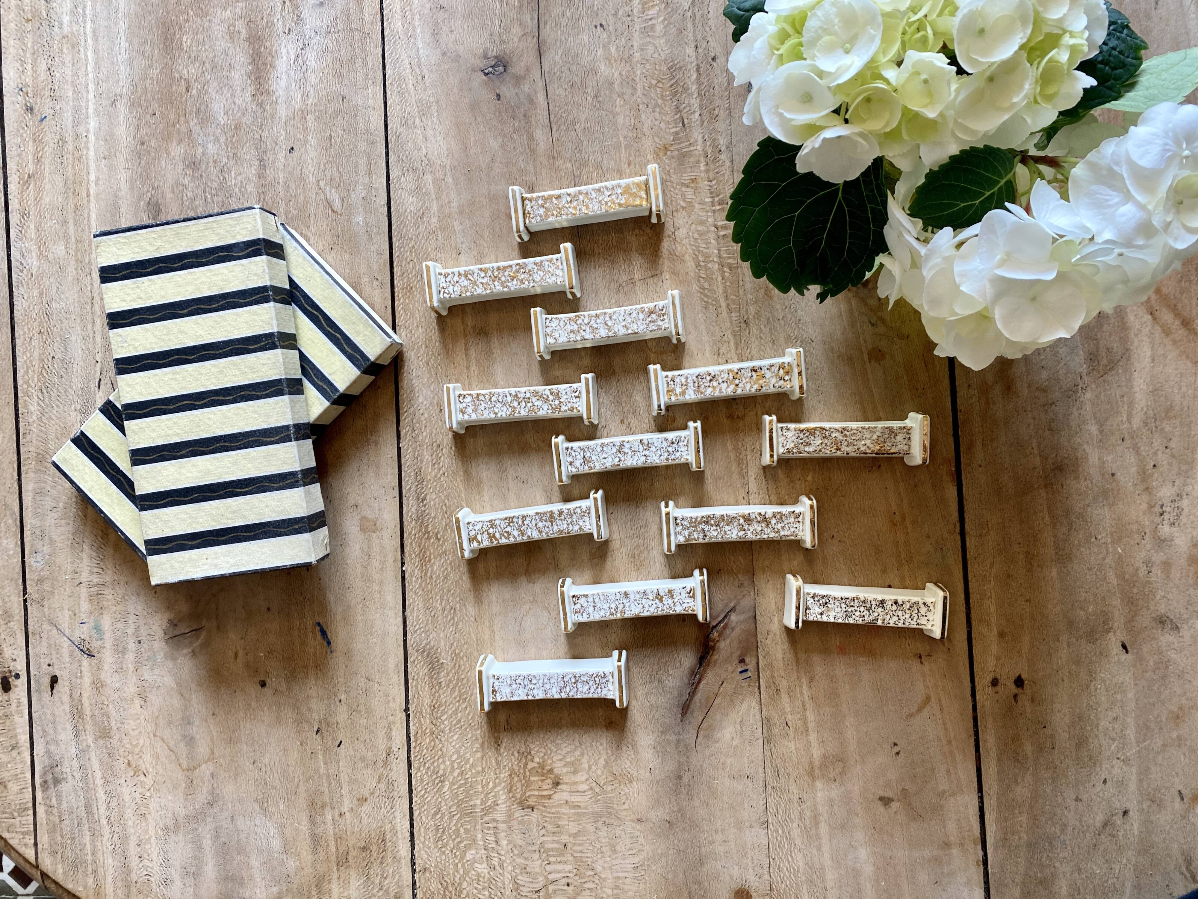 Set of 10 vintage art deco knife holders in white and gold ceramic