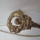 Embrasse  en laiton doré, décor couronne de lauriers