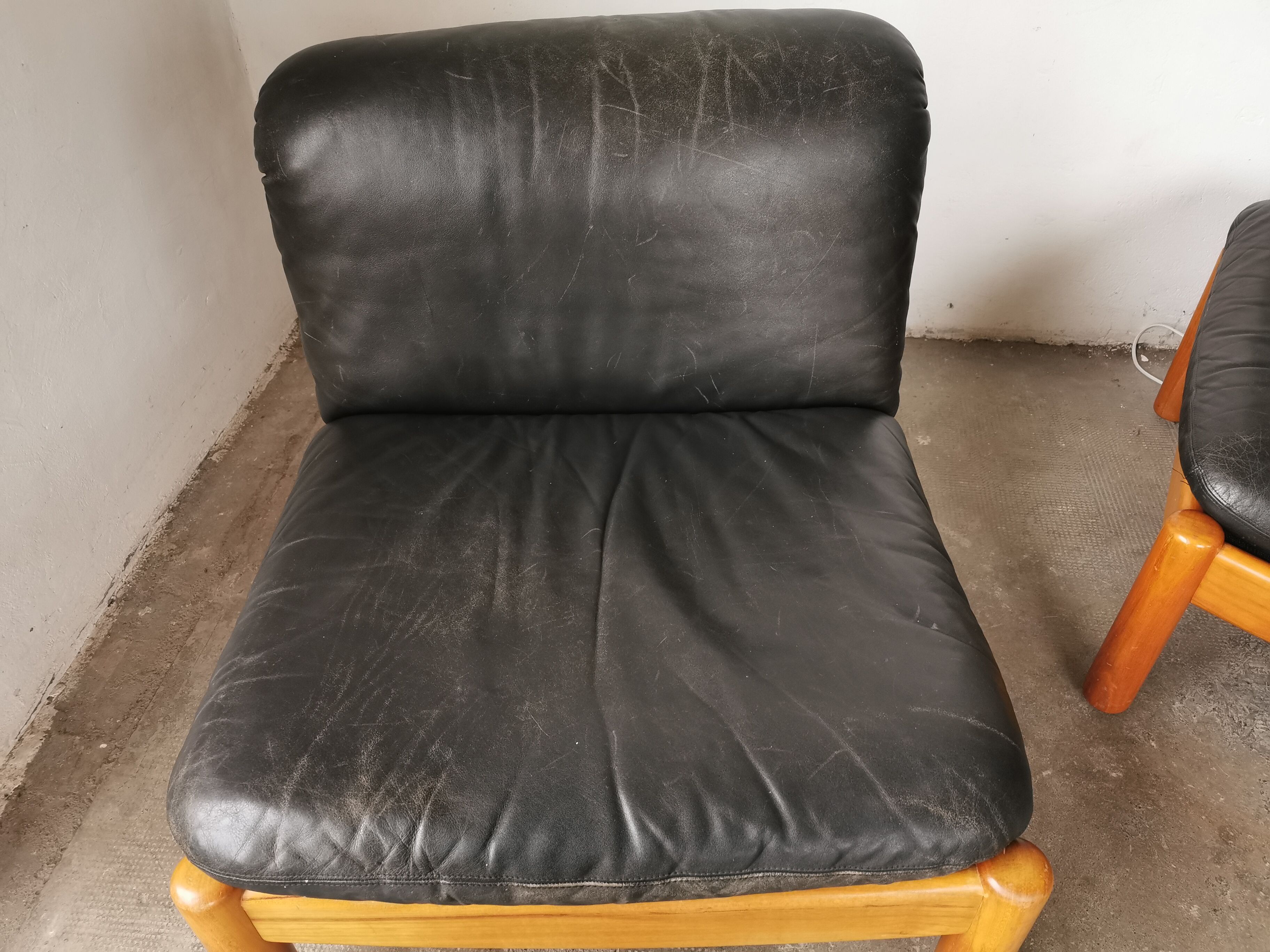 Pair of designer leather armchairs 80s