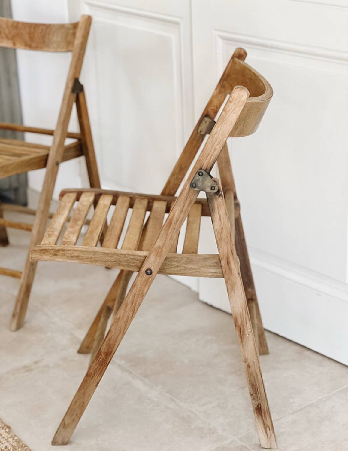 Pair of folding wooden chairs