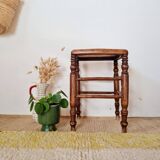 Wooden stool with cane seat