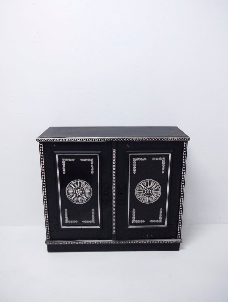 Antique wooden cabinet painted in black and with incised white painted decorations, Ettore Zaccari, Italy c 1910
