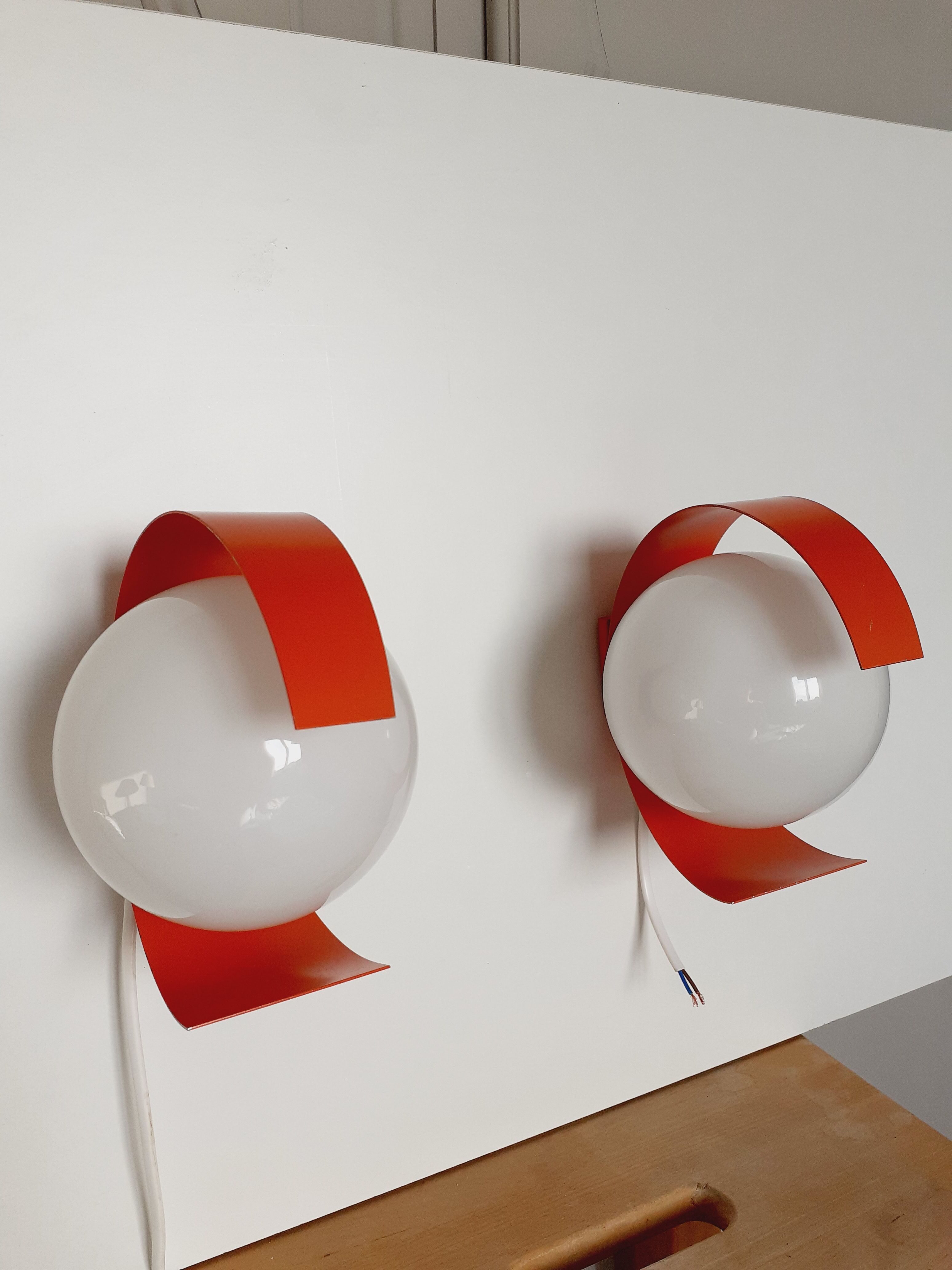 Pair of orange space age wall lamps